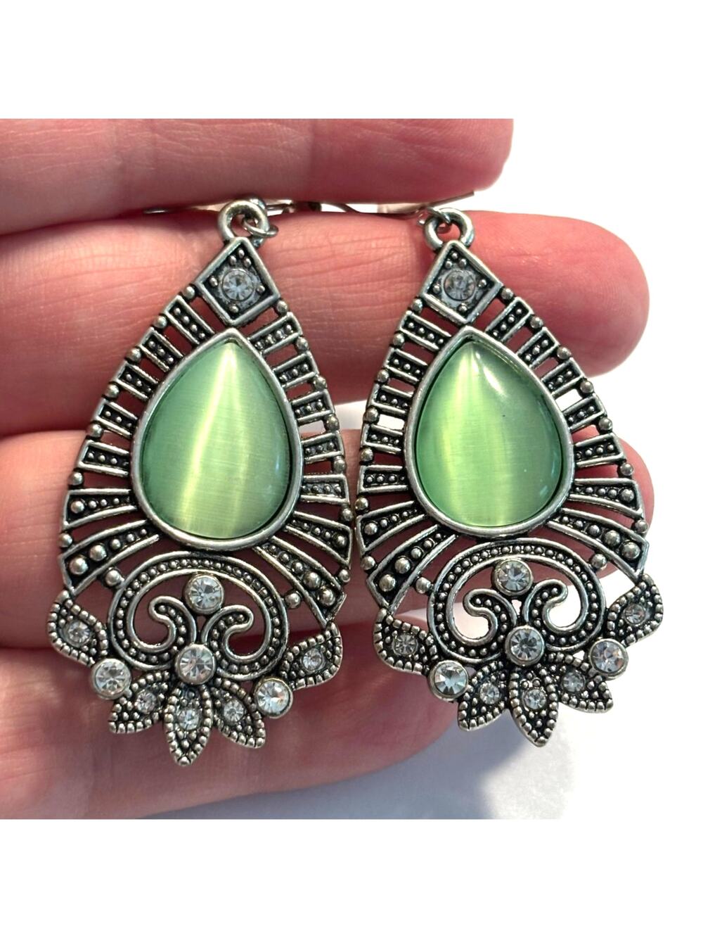 Pierced earrings ornate Silvertone teardrops green moonstone centers drop dangle